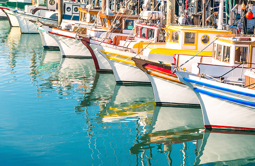 Colorful sailing boats at Fisherman's Wharf of San Francisco Bay - California - United States