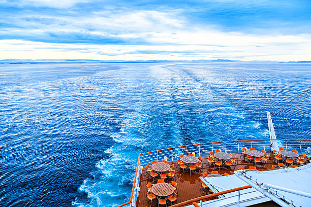 Few round tables with chairs on deck Round tables with chairs on deck of liner cruise liner stock pictures, royalty-free photos & images