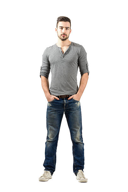 Young fit standing man with hands in pocket