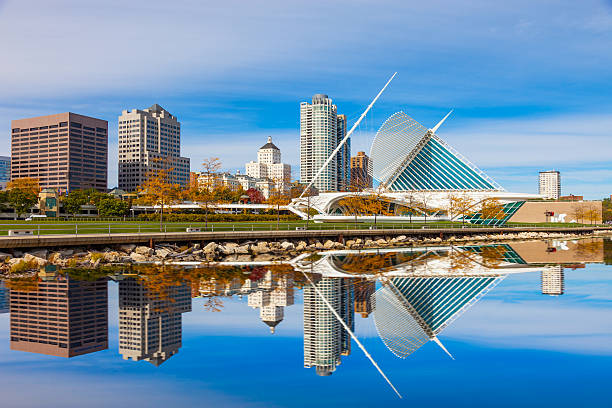Skyscrapers skyline of Milwaukee and Lake Michigan, WI Skyscrapers skyline of Milwukee and reflections in Lake Michigan, WI milwaukee wisconsin stock pictures, royalty-free photos & images