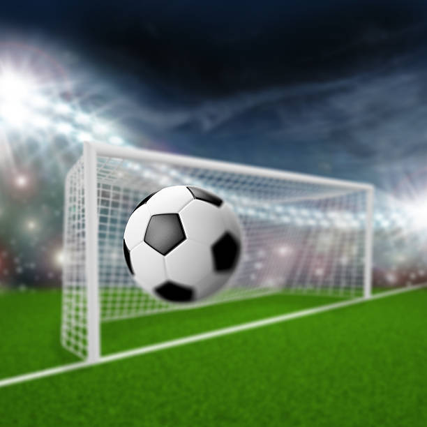 istock soccer ball flies into the goal 522894219