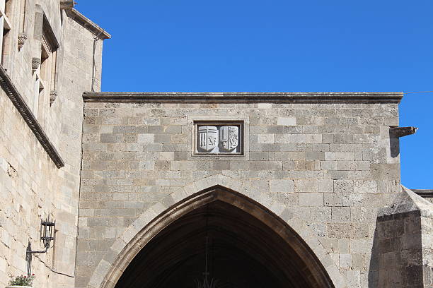 istock arms above the arched entrance 522894509