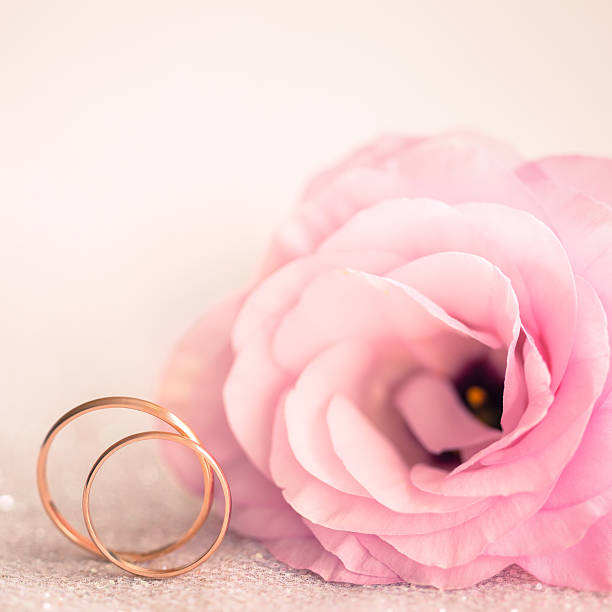 istock Delicate Wedding background with Rings and Pink Flower 522894765
