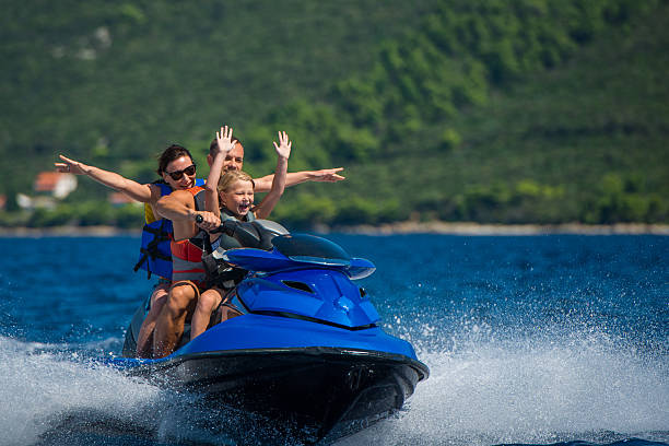 istock Family Riding A Jet Boat 522896015