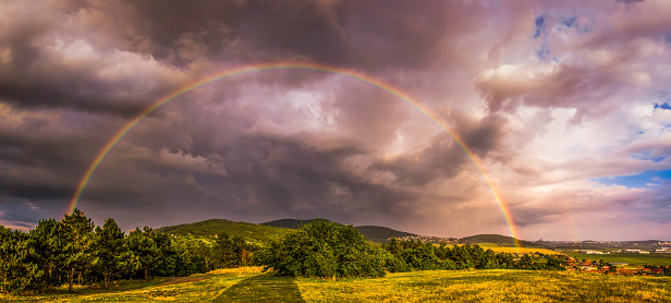 Rainbow over Landscape at Sunset with City of Nitra in Background
