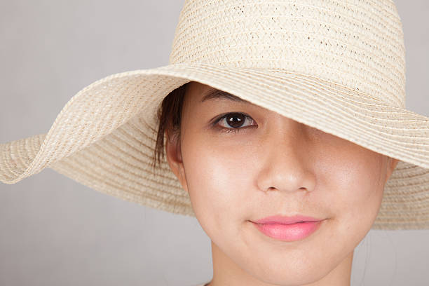 istock Beautiful Asian girl with sun hat 522896197