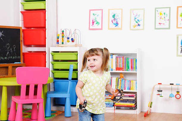 istock Little Girl Playing Ethnic Instruments 522897423