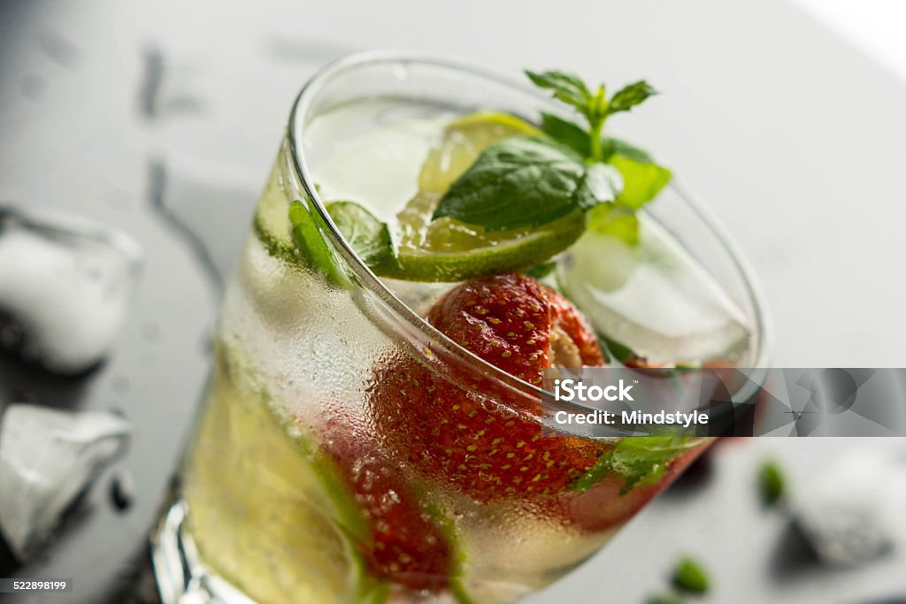 Strawberry mojito Fresh strawberry mojito on a wooden table Alcohol - Drink Stock Photo