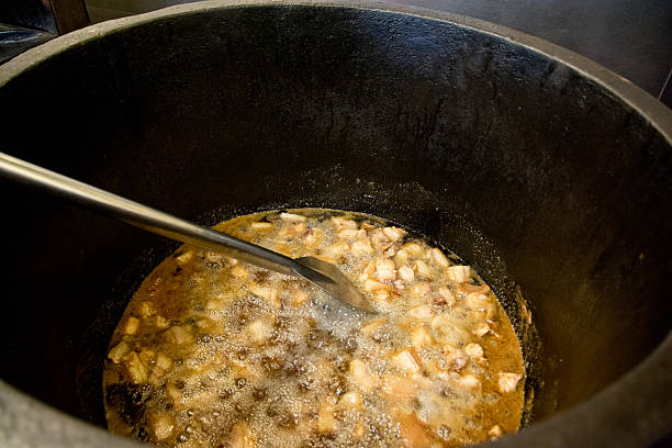 istock Iron kettle with cracklings cooking 522898699
