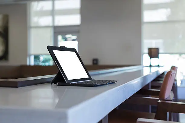 Sitting on a counter this tablet awaits an image of your webpage or message.