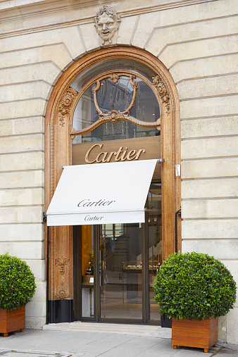Paris, France - July 8, 2014: Cartier shop in place Vendome in Paris. The company with its headquarters in Paris is now a wholly owned subsidiary of Compagnie Financiaire Richemont SA.