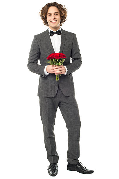 istock Groom in tuxedo posing with a bouquet 522910265