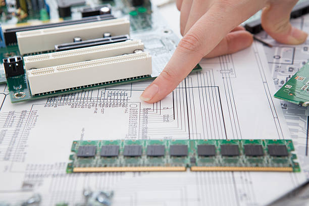 istock People to discuss the circuit board while watching the blueprint 522910477