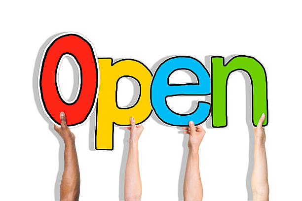 istock Diverse People's Hands Holding Word Open 522910763