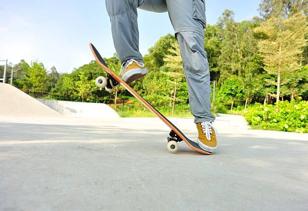 istock skateboarding woman jumping 522911113
