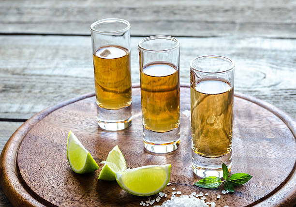 istock Glasses of tequila on the wooden board 522911607