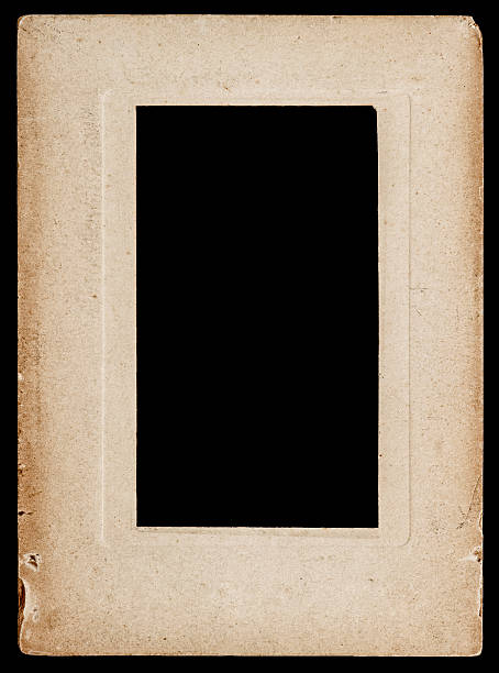 istock aged paper photo frame isolated on black 522912649