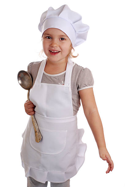istock Little girl dressed as a cook on an isolated background 522914119
