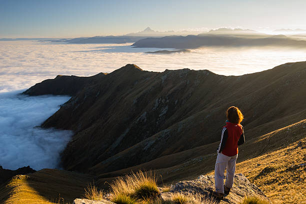 istock Woman resting on the mountain top 522921283