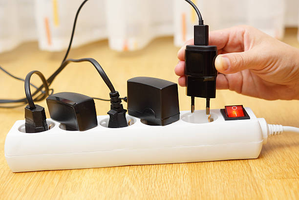 istock Woman unplugged plug to save on energy 522922519