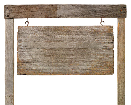 Old weathered wooden sign board hanging by hooks from a wooden frame, isolated on white, clipping path included.