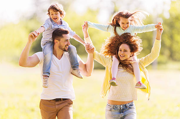 istock Happy family piggybacking in nature. 522924009