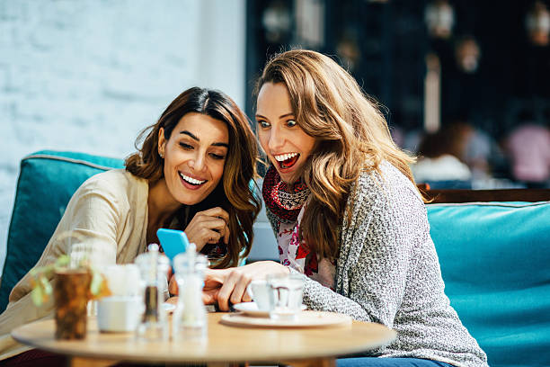 istock Young women drinking tea and coffee 522924135