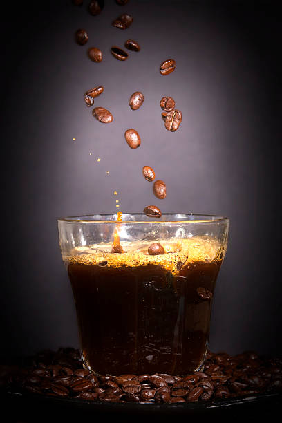 istock Coffee Splash. Coffee being poured into a glass. 522924183