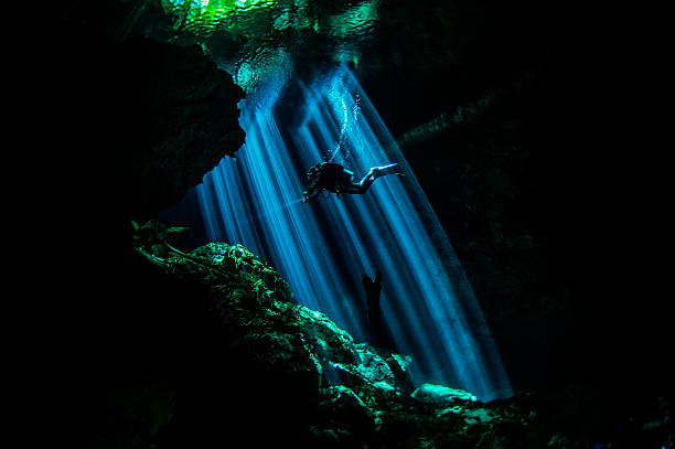 istock Rays of light in underwater caves 522926111