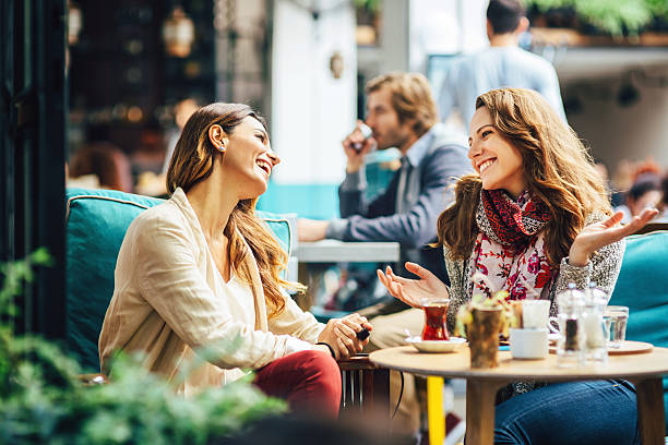 istock Young women drinking tea and coffee 522945027
