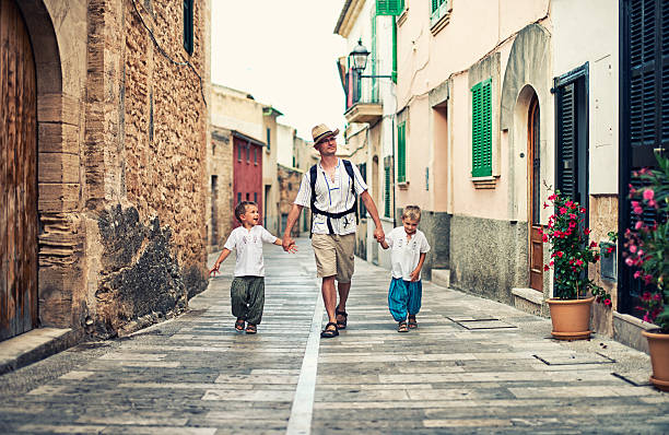 istock Family visiting mediterranean town. 522945603