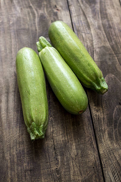 istock Fresh zucchin on a old wooden board 522945917