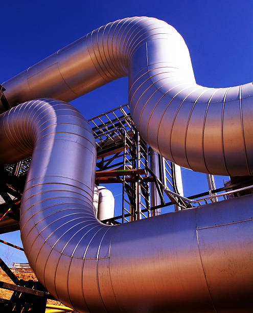 istock Industrial zone, Steel pipelines at sunset 522946431