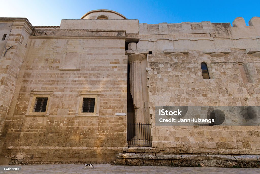Cathedral in Siracusa, Sicily (Side View), Italy A side view of the Siracusa Cathedral in Sicily. The Siracusa Cathedral was built on the site of the ancient Temple of Athena, and the original pillar of the temple can still be seen here. 18th Century Stock Photo