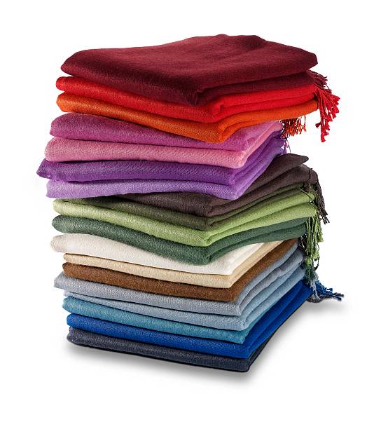 Pashminas Pile of colourful pashmina scarves. pashmina stock pictures, royalty-free photos & images