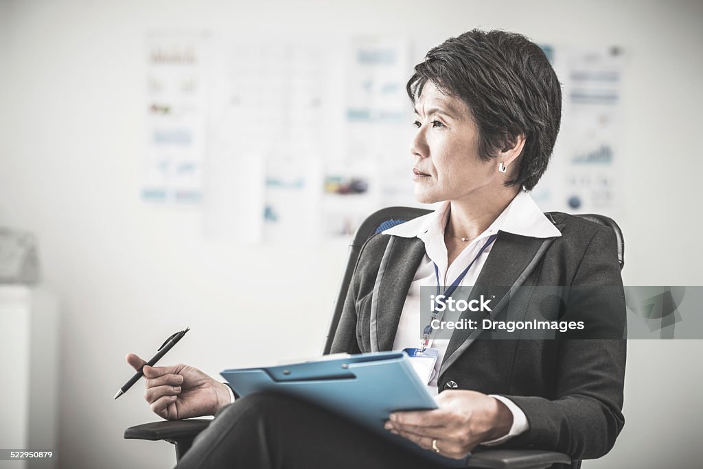 Female chief Portrait of female chief sitting in her office Businesswoman Stock Photo