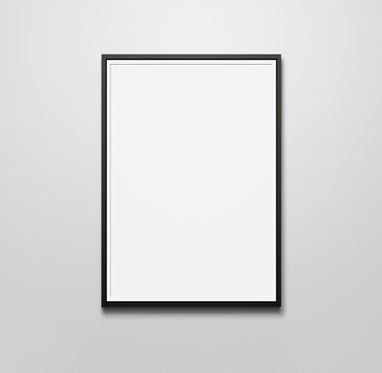 Close up of blank picture frame at the wall with copy space