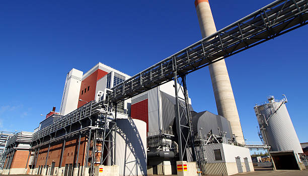 istock Modern industrial factory against blue sky 522960645