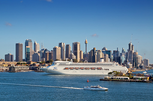 Sydney,Australia - November 7,2014: The P&O cruise liner Pacific Jewel is guided out to sea by a tug boat at the start of a cruise to Vanuatu and New Caledonia.