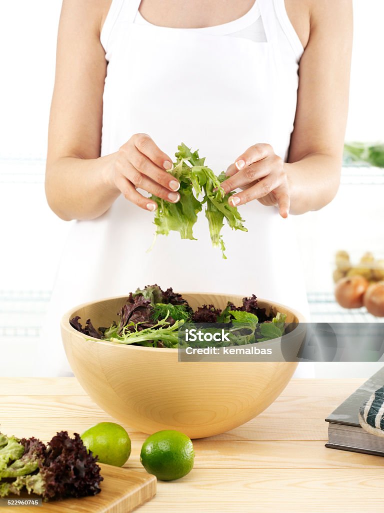 salad woman mixing salad Adult Stock Photo