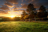 istock Picturesque landscape, fenced ranch at sunrise 522961501