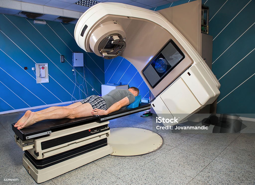 Man Receiving Radiation Therapy for Cancer Treatment Radiotherapy Stock Photo