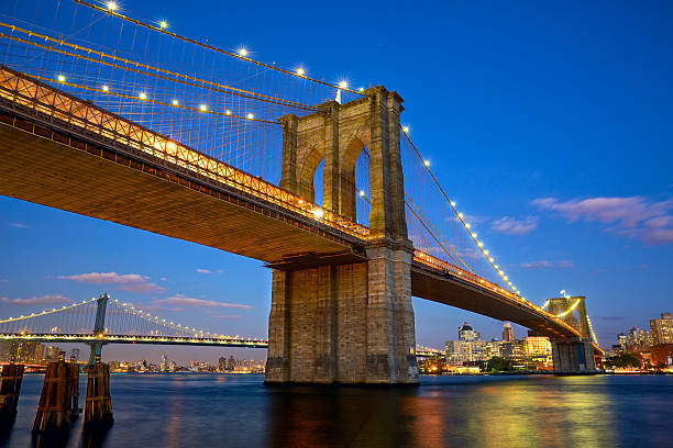 Brooklyn Bridge Brooklyn Bridge at twilight in New York City east river new york city photos stock pictures, royalty-free photos & images
