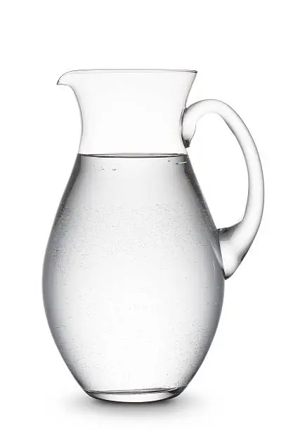 jug full of natural water, on white background