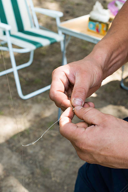 istock Boy hook bait on a fishing hook 522982753