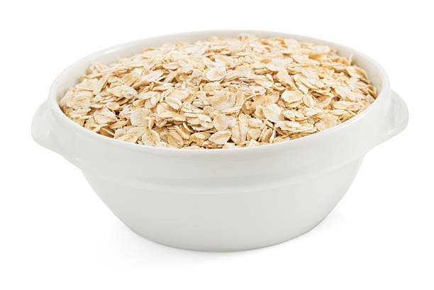 istock bowl of oat flake on white 522983297