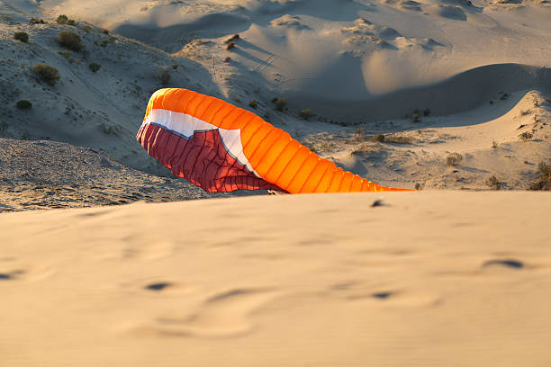 istock Parachute landed on the beach. 522983441