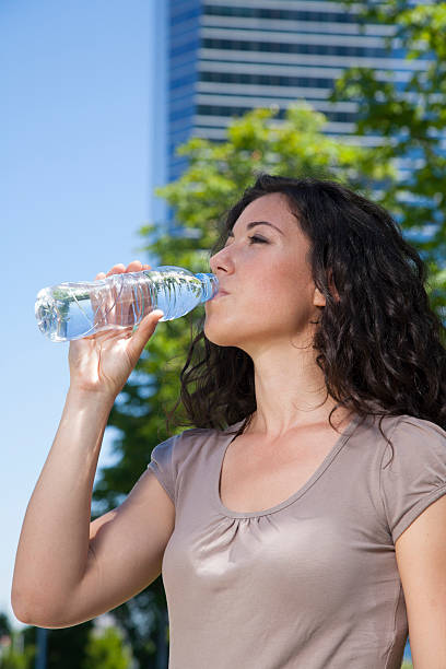 istock urban woman drinking water 522983755