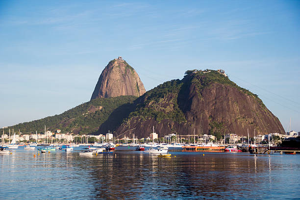 Sugar Loaf and his boats. Guanabara bay, with the Sugar Loaf in the middle, seen from the beach of Botafogo, Rio de Janeiro, Brazil. sugarloaf mountain stock pictures, royalty-free photos & images