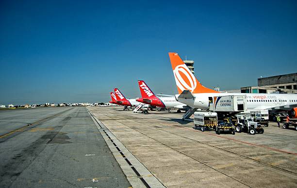 Guarulhos International Airport in Sao Paulo Sao Paulo, Brazil - June 13, 2014: Gol and TAM airlines at the Guarulhos International Airport in Sao Paulo, during the busy time of the 2014 FIFA World Cup, one day after the tournament had started. guarulhos photos stock pictures, royalty-free photos & images